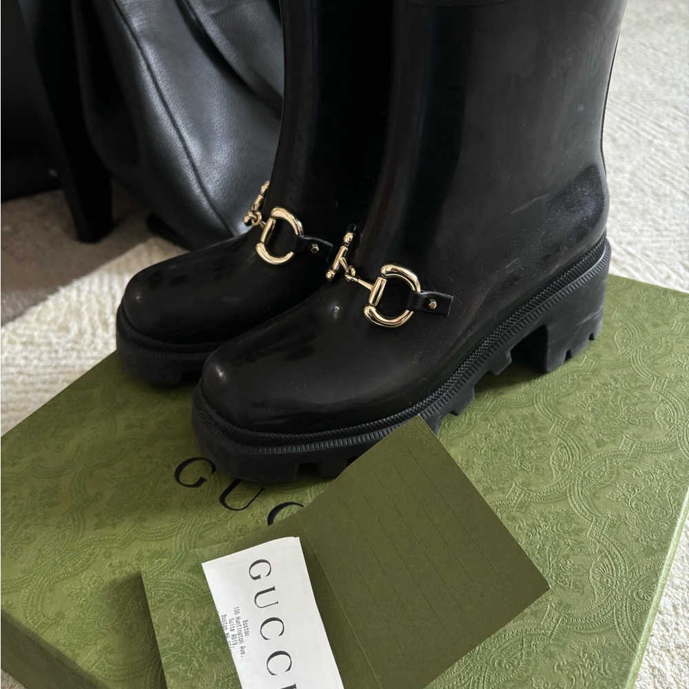 Gucci Black Boots with Gold Detailing